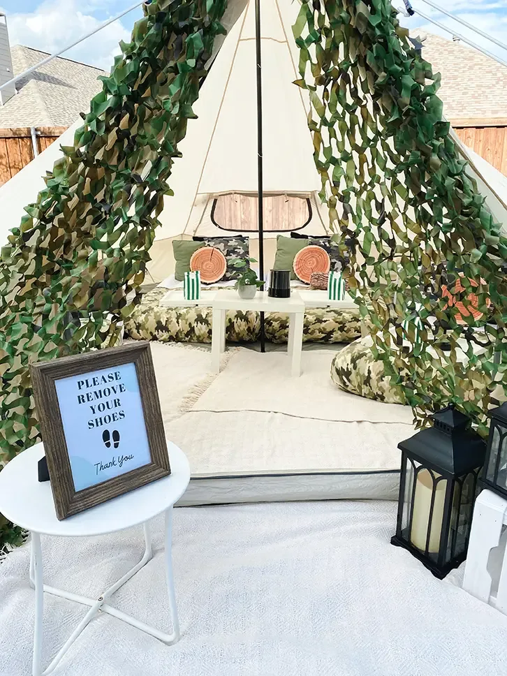 Inside a styled luxury bell tent with mattresses, cushions and lanterns