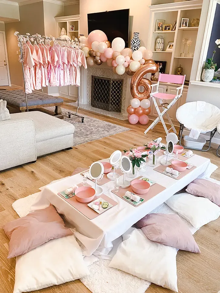 Spa party with a robe rack, styled spa table and cloud mirrors