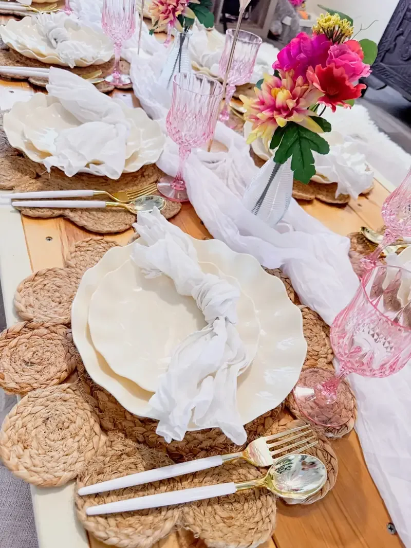 Luxe picnic place setting with gold cutlery and pink glassware