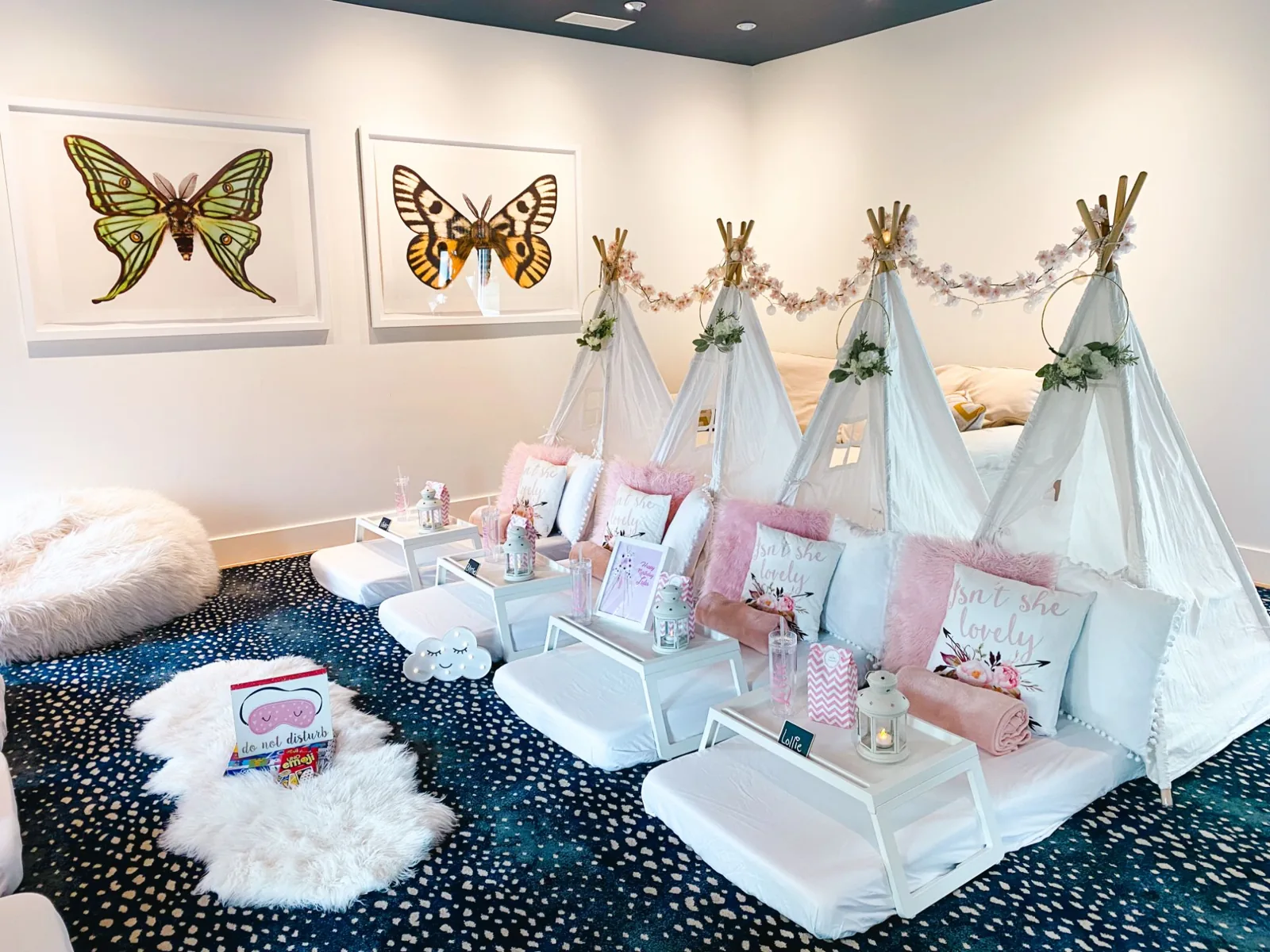 Teepee sleepover in a room with butterfly art